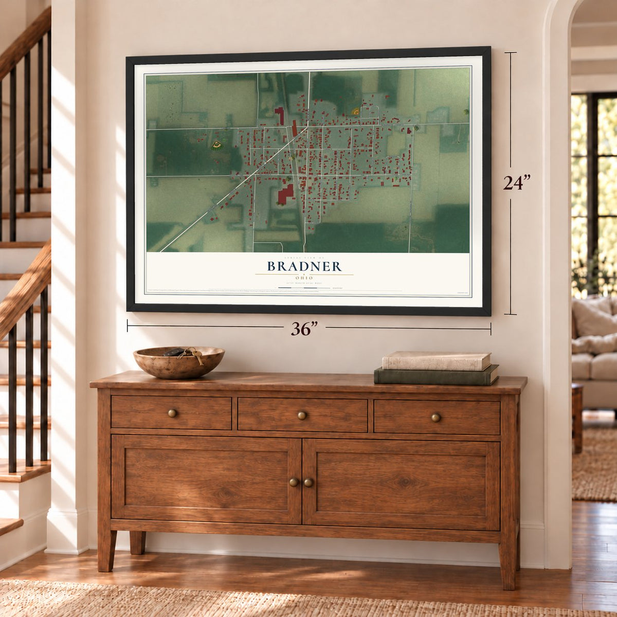 Bradner, Ohio map, 24 x 36 inch print in a black frame above a dresser by a staircase