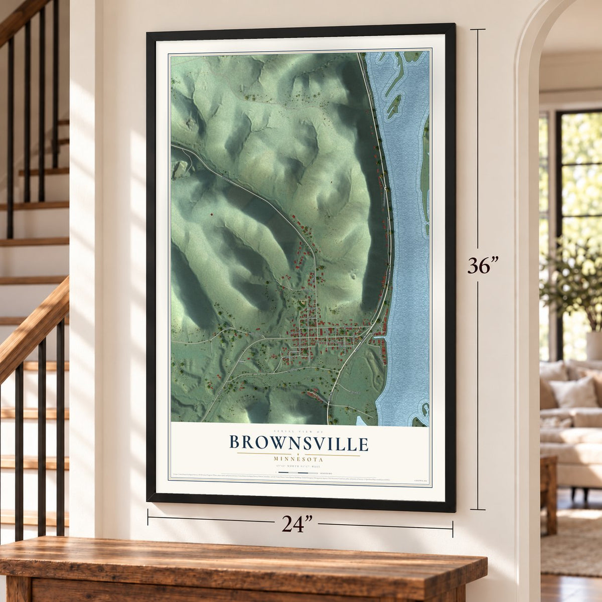 Brownsville, Minnesota map, 24 x 36 inch print in a black frame by a staircase