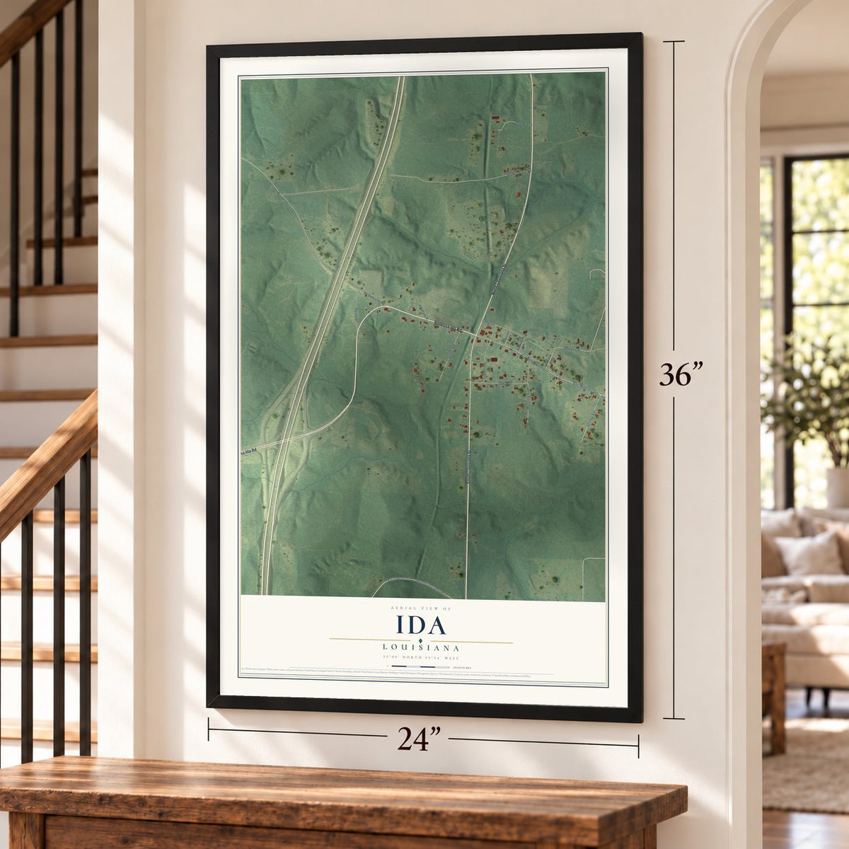 Ida, Louisiana map, 24 x 36 inch print in a black frame by a staircase