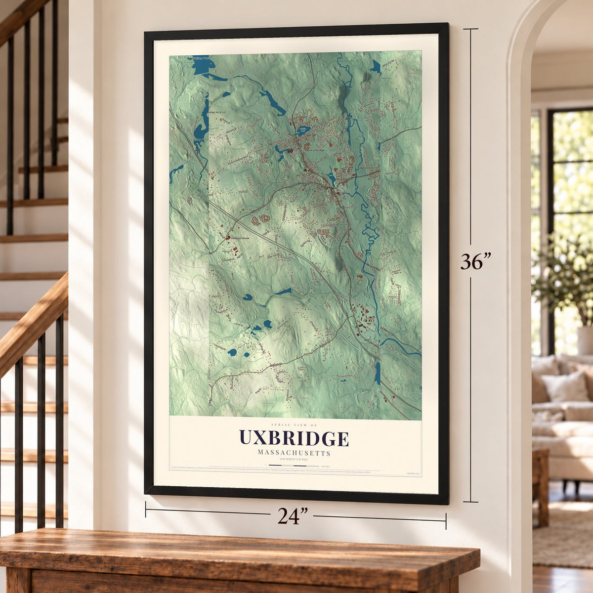 Uxbridge, Massachusetts map, 24 x 36 inch print in a black frame by a staircase