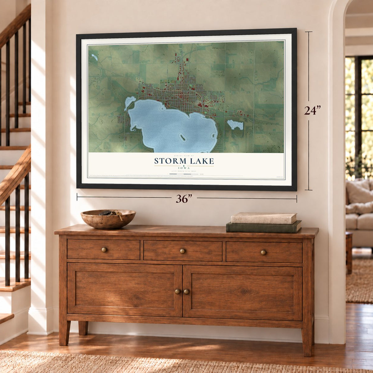 Storm Lake, Iowa map, 24 x 36 inch print in a black frame above a dresser by a staircase