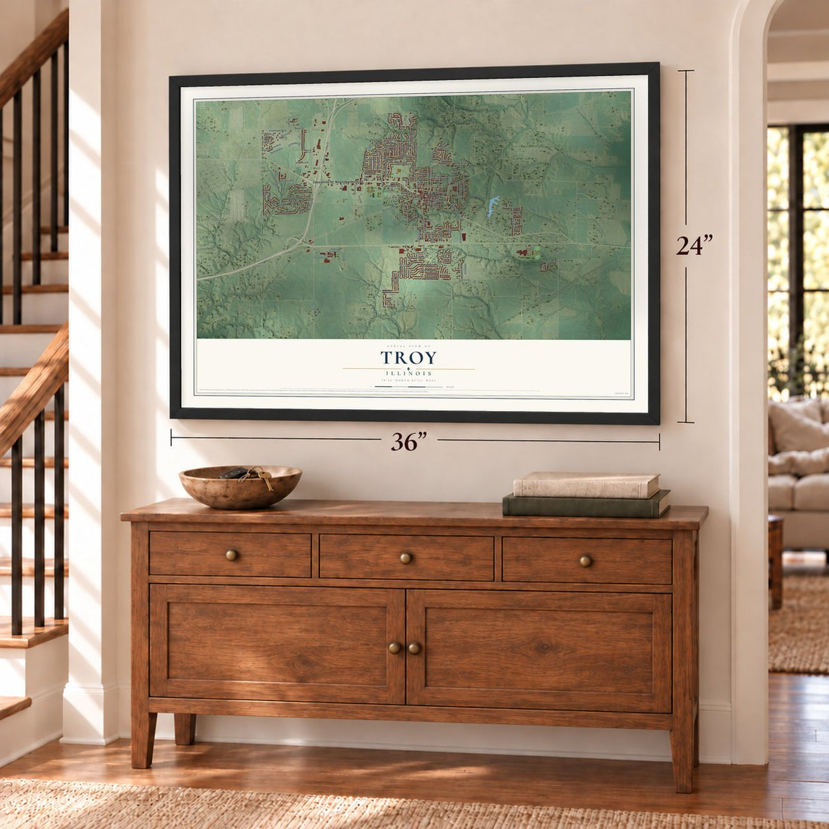 Troy, Illinois map, 24 x 36 inch print in a black frame above a dresser by a staircase