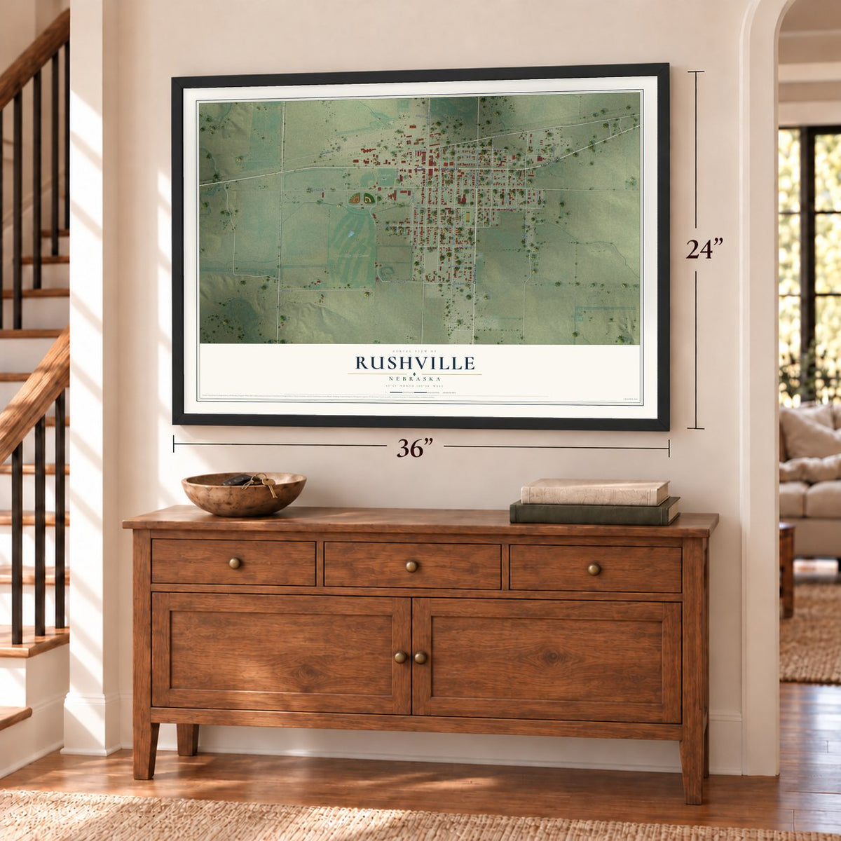 Rushville, Nebraska map, 24 x 36 inch print in a black frame above a dresser by a staircase
