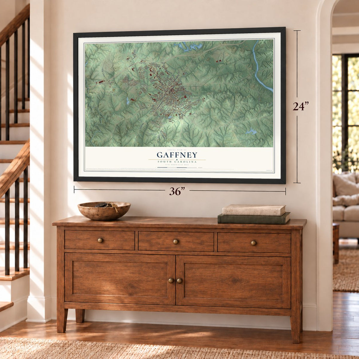 Gaffney, South Carolina map, 24 x 36 inch print in a black frame above a dresser by a staircase