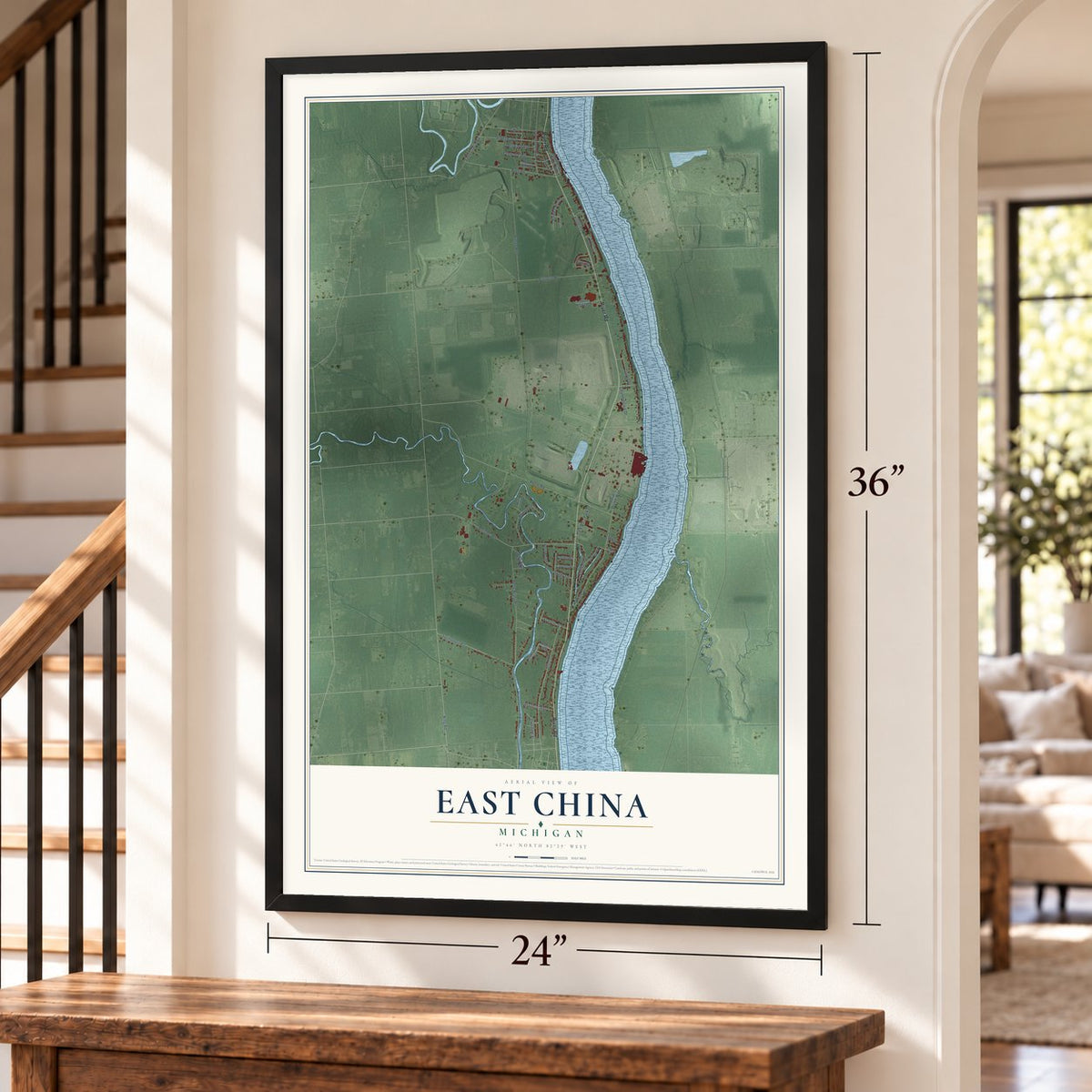 East China, Michigan map, 24 x 36 inch print in a black frame by a staircase