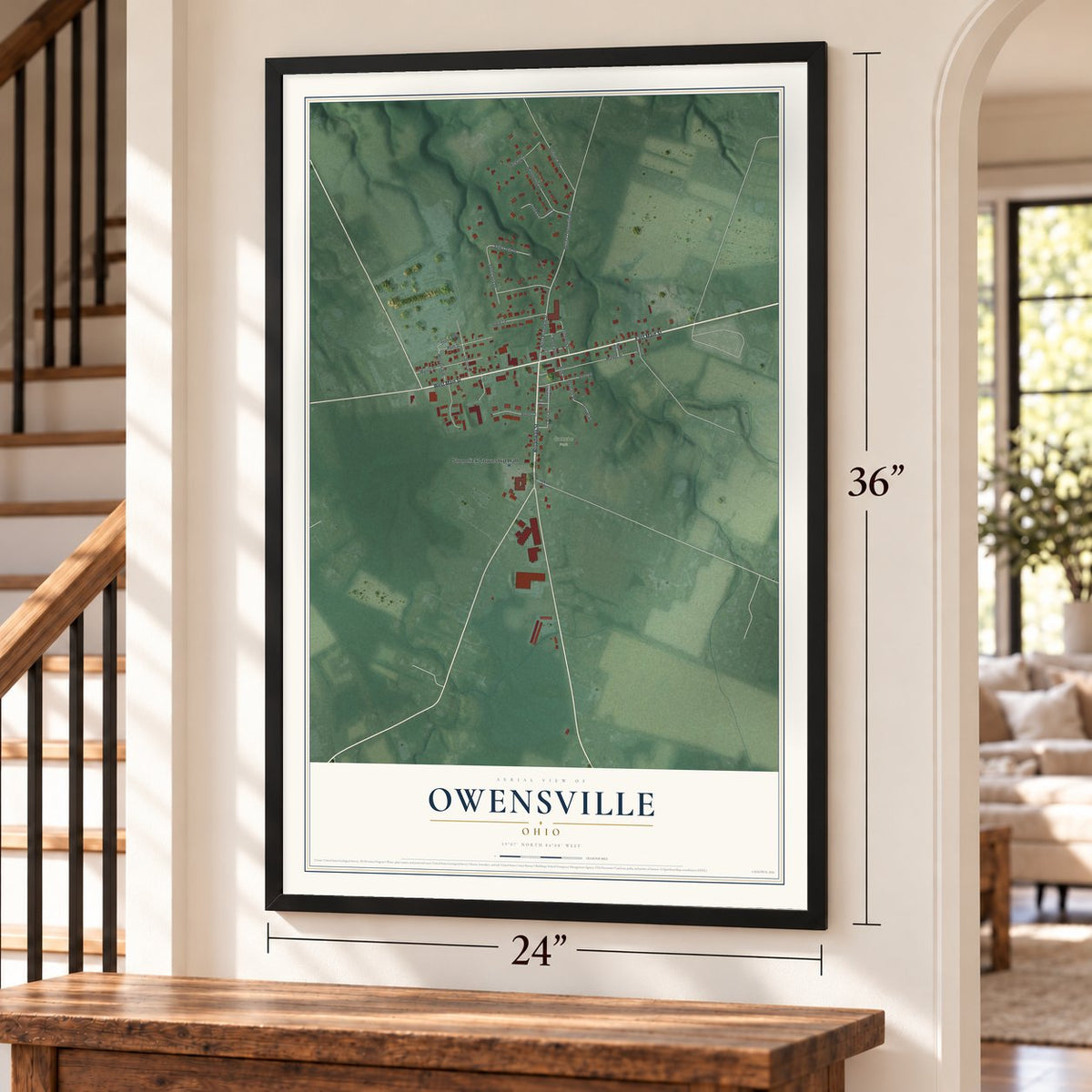 Owensville, Ohio map, 24 x 36 inch print in a black frame by a staircase