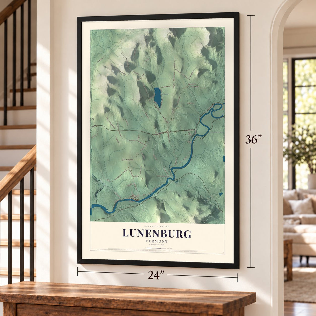 Lunenburg, Vermont map, 24 x 36 inch print in a black frame by a staircase