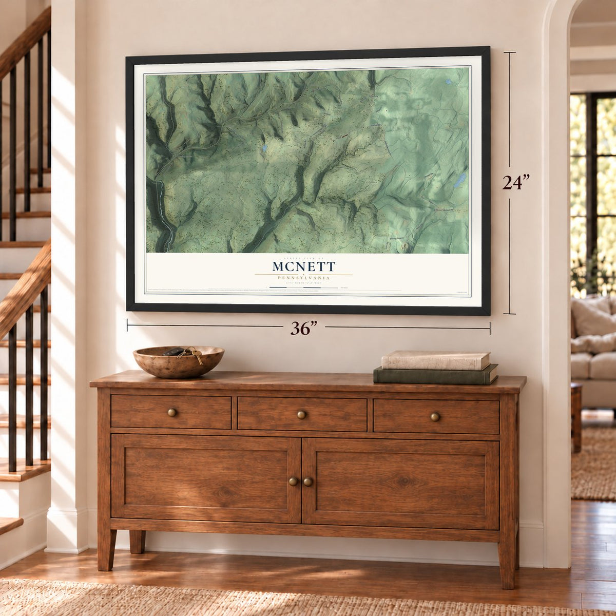 McNett, Pennsylvania map, 24 x 36 inch print in a black frame above a dresser by a staircase