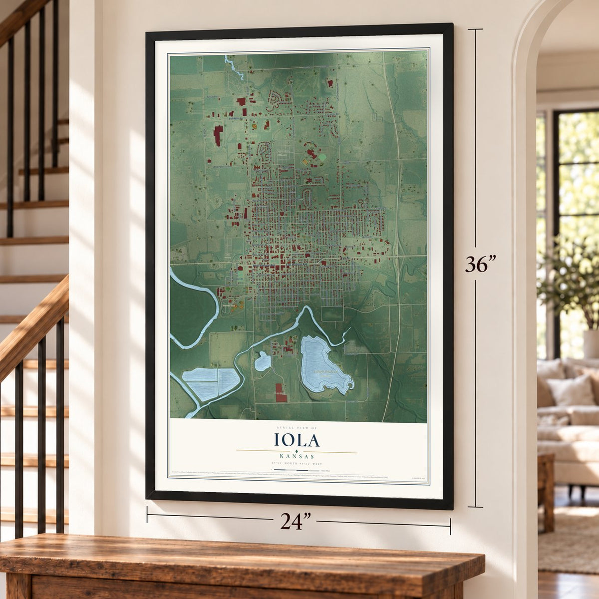 Iola, Kansas map, 24 x 36 inch print in a black frame by a staircase