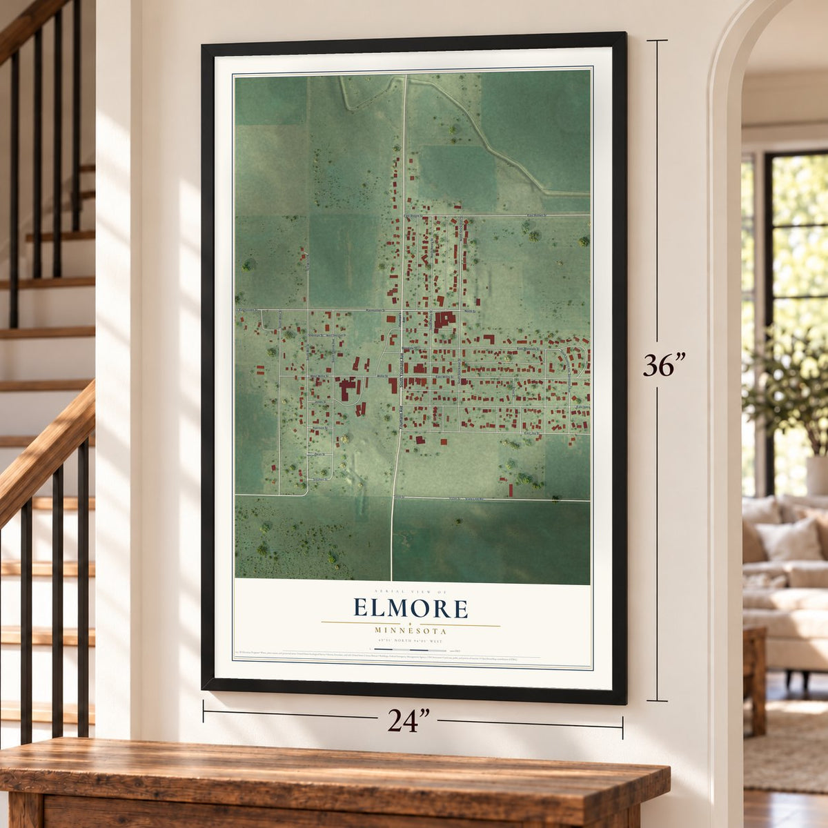 Elmore, Minnesota map, 24 x 36 inch print in a black frame by a staircase