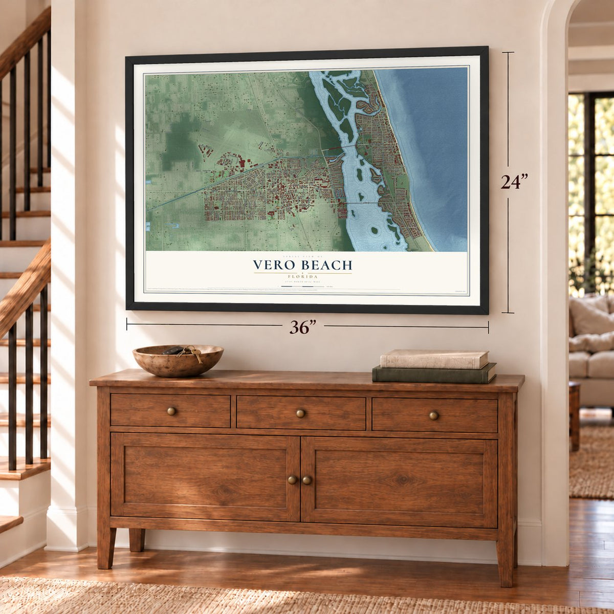Vero Beach, Florida map, 24 x 36 inch print in a black frame above a dresser by a staircase