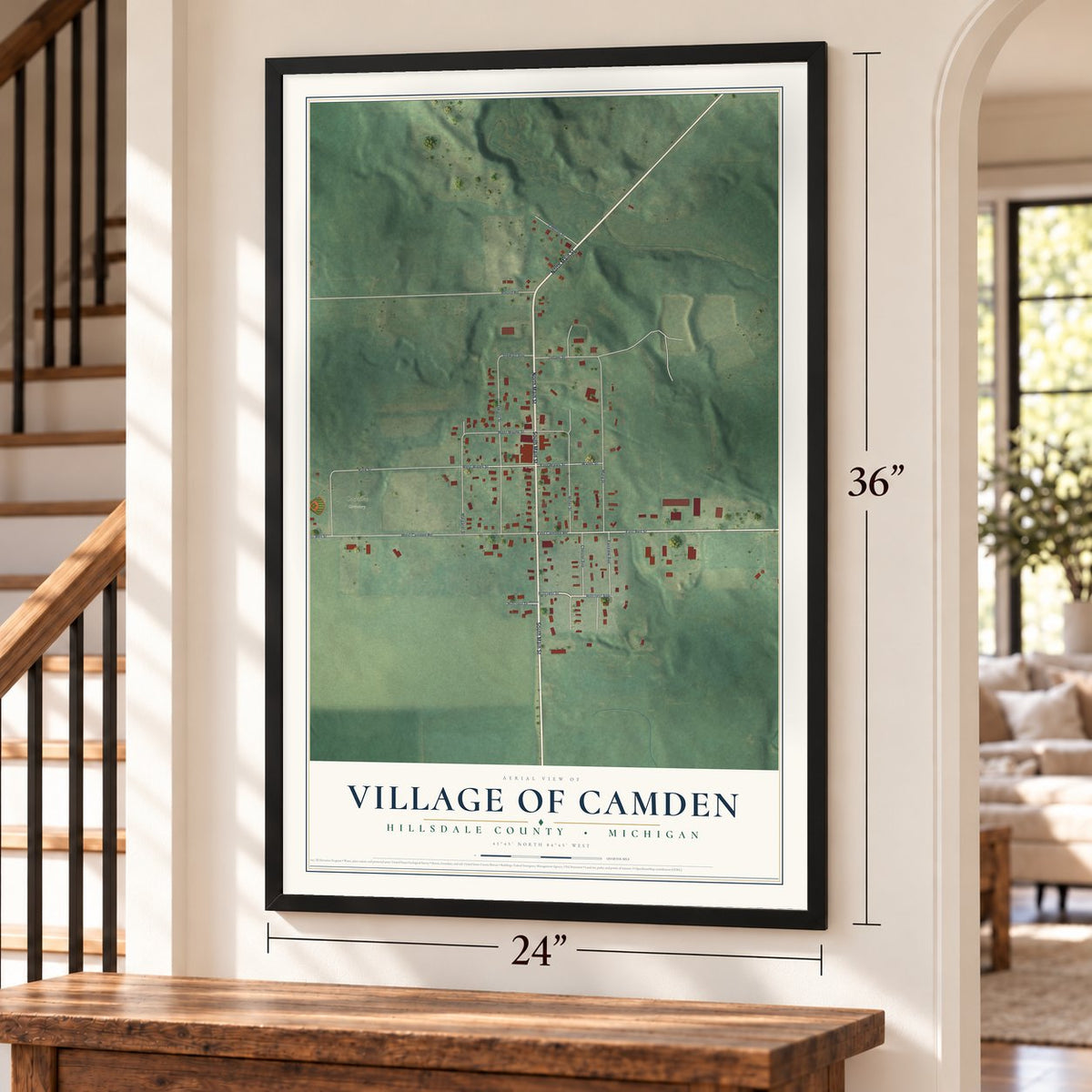 Camden, Michigan map, 24 x 36 inch print in a black frame by a staircase
