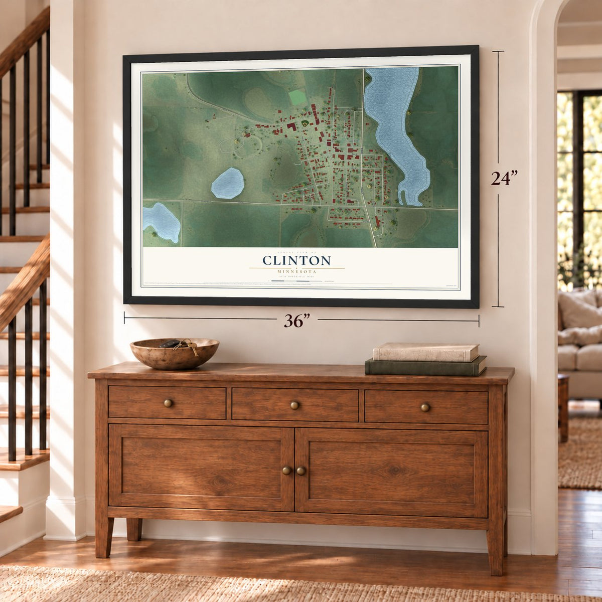 Clinton, Minnesota map, 24 x 36 inch print in a black frame above a dresser by a staircase