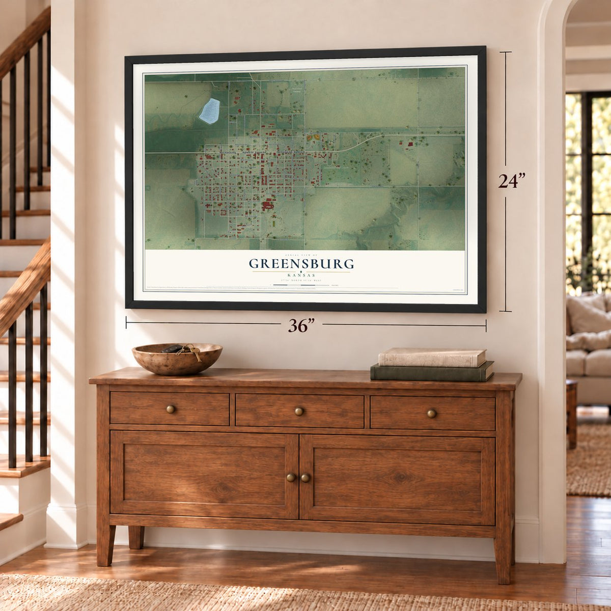 Greensburg, Kansas map, 24 x 36 inch print in a black frame above a dresser by a staircase