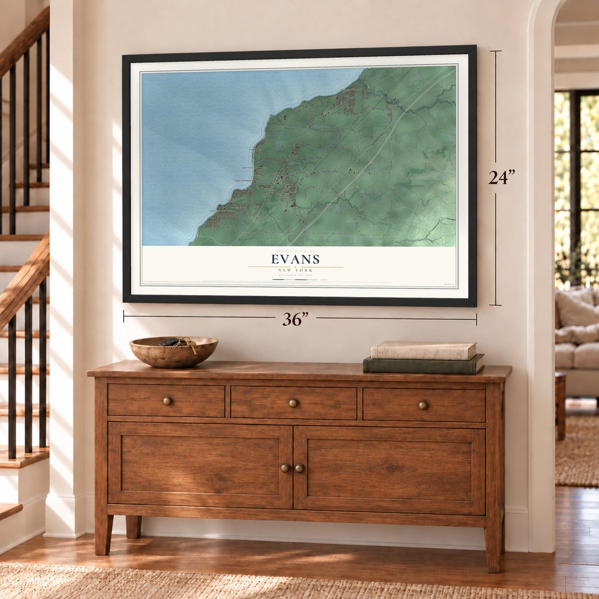 Evans, New York map, 24 x 36 inch print in a black frame above a dresser by a staircase