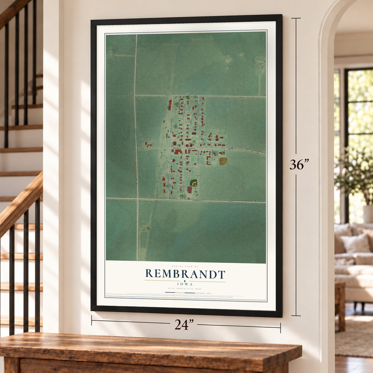 Rembrandt, Iowa map, 24 x 36 inch print in a black frame by a staircase