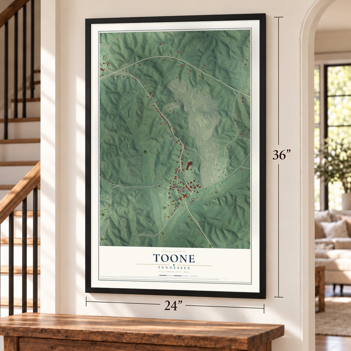 Toone, Tennessee map, 24 x 36 inch print in a black frame by a staircase