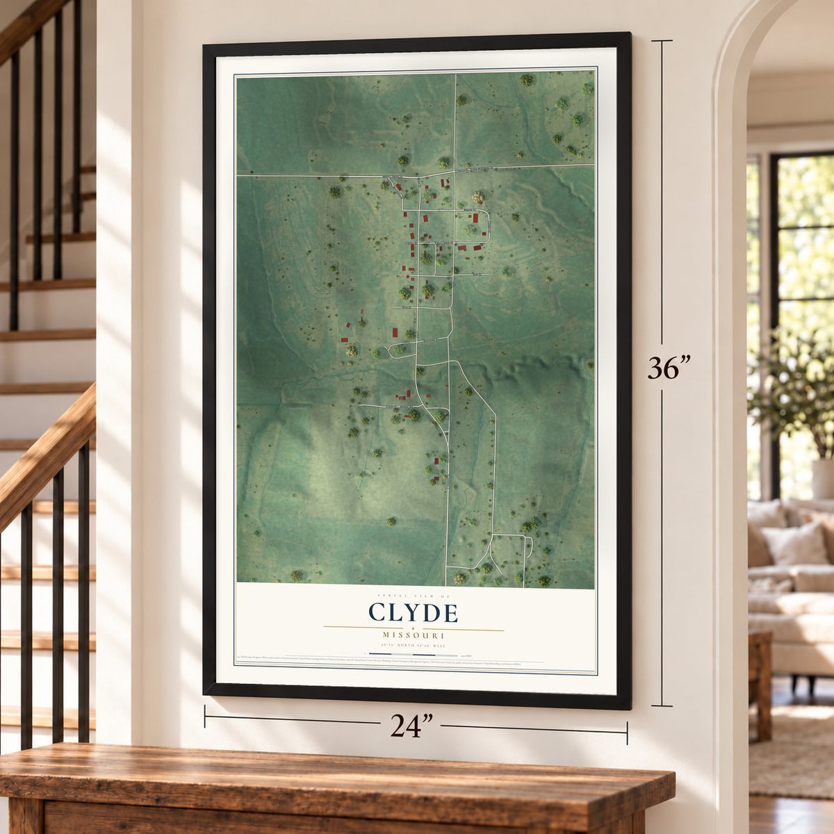 Clyde, Missouri map, 24 x 36 inch print in a black frame by a staircase