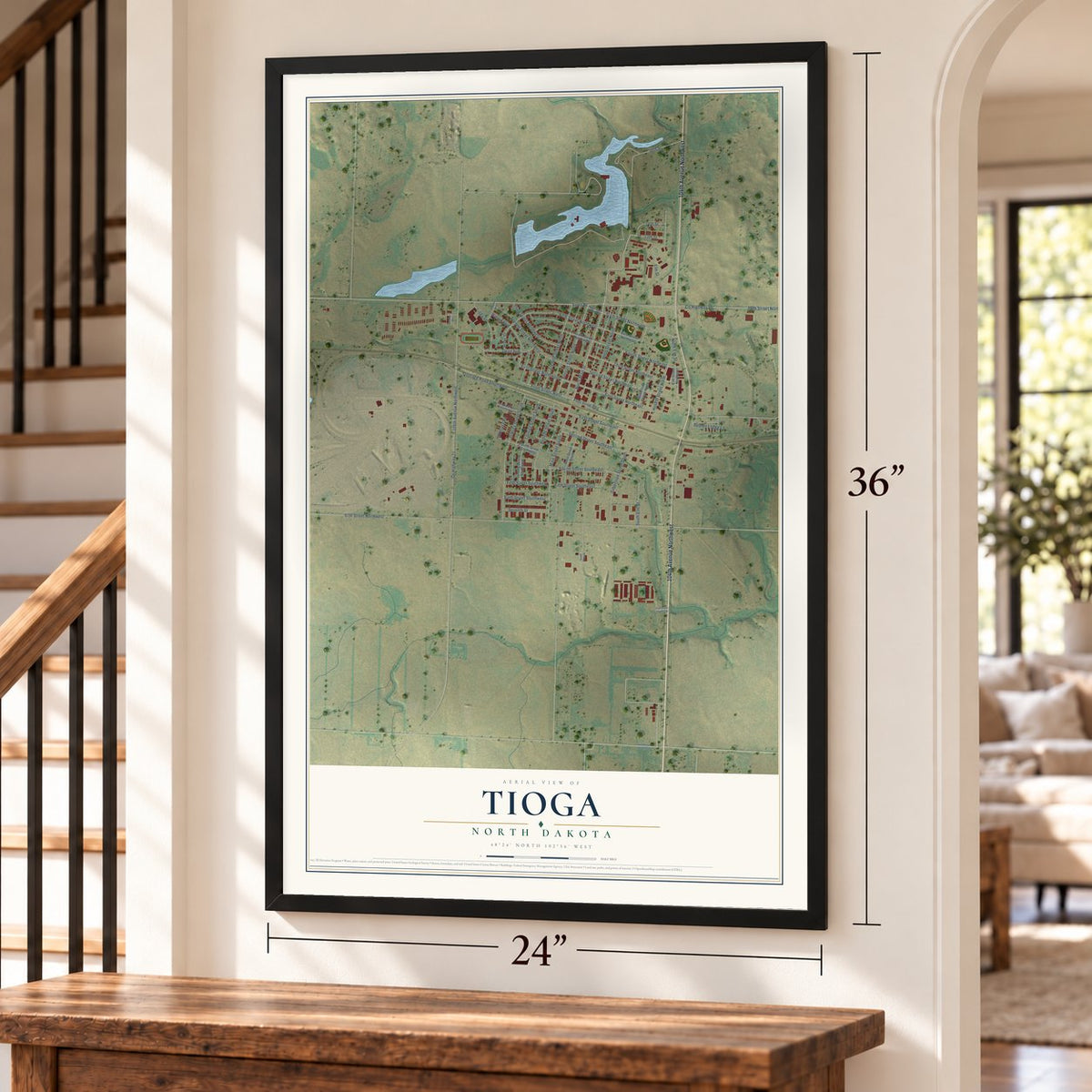 Tioga, North Dakota map, 24 x 36 inch print in a black frame by a staircase
