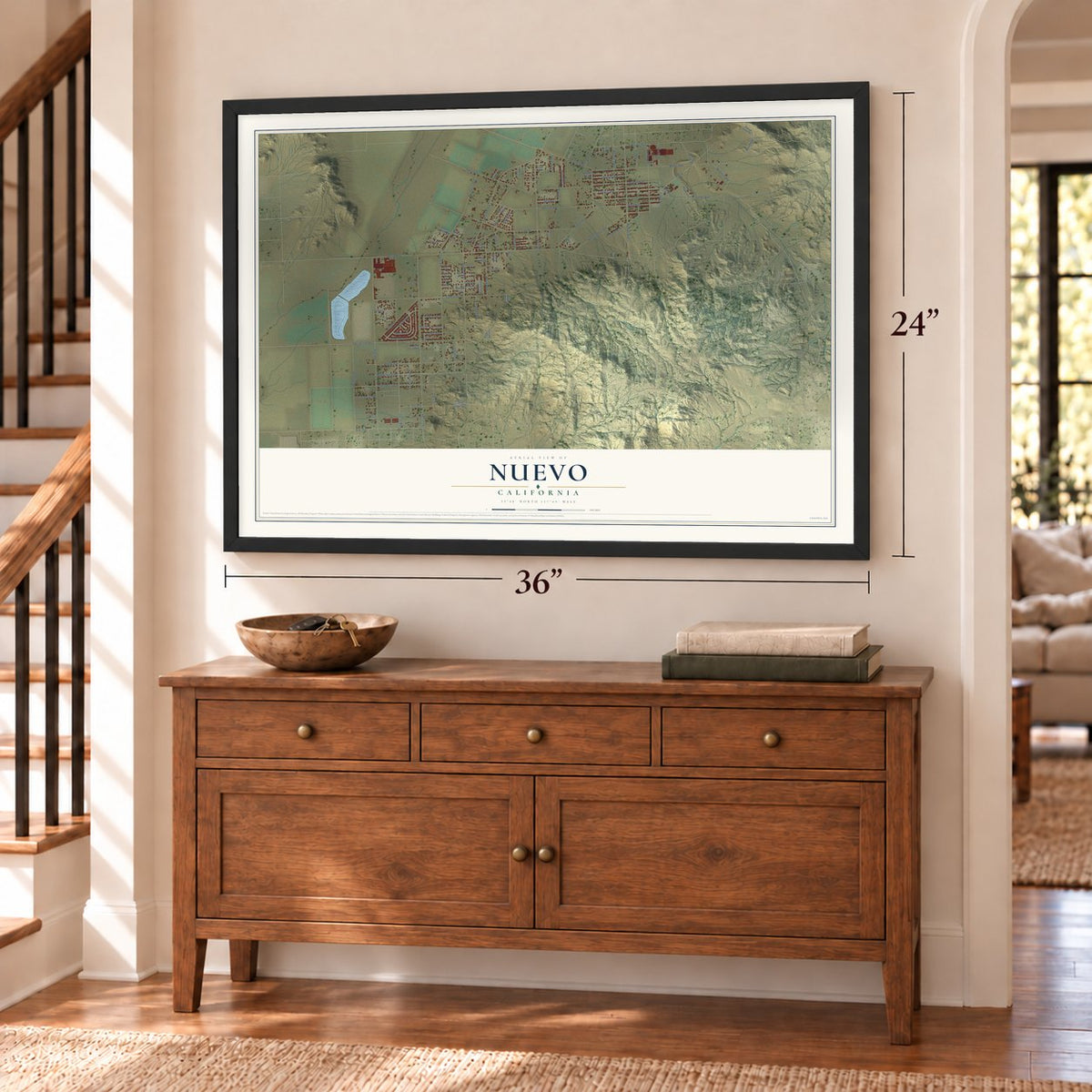 Nuevo, California map, 24 x 36 inch print in a black frame above a dresser by a staircase