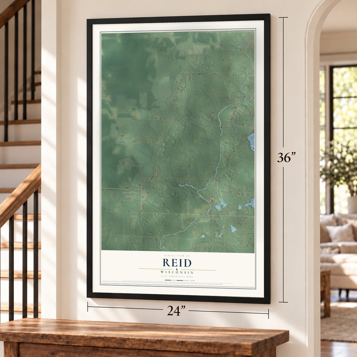 Reid, Wisconsin map, 24 x 36 inch print in a black frame by a staircase