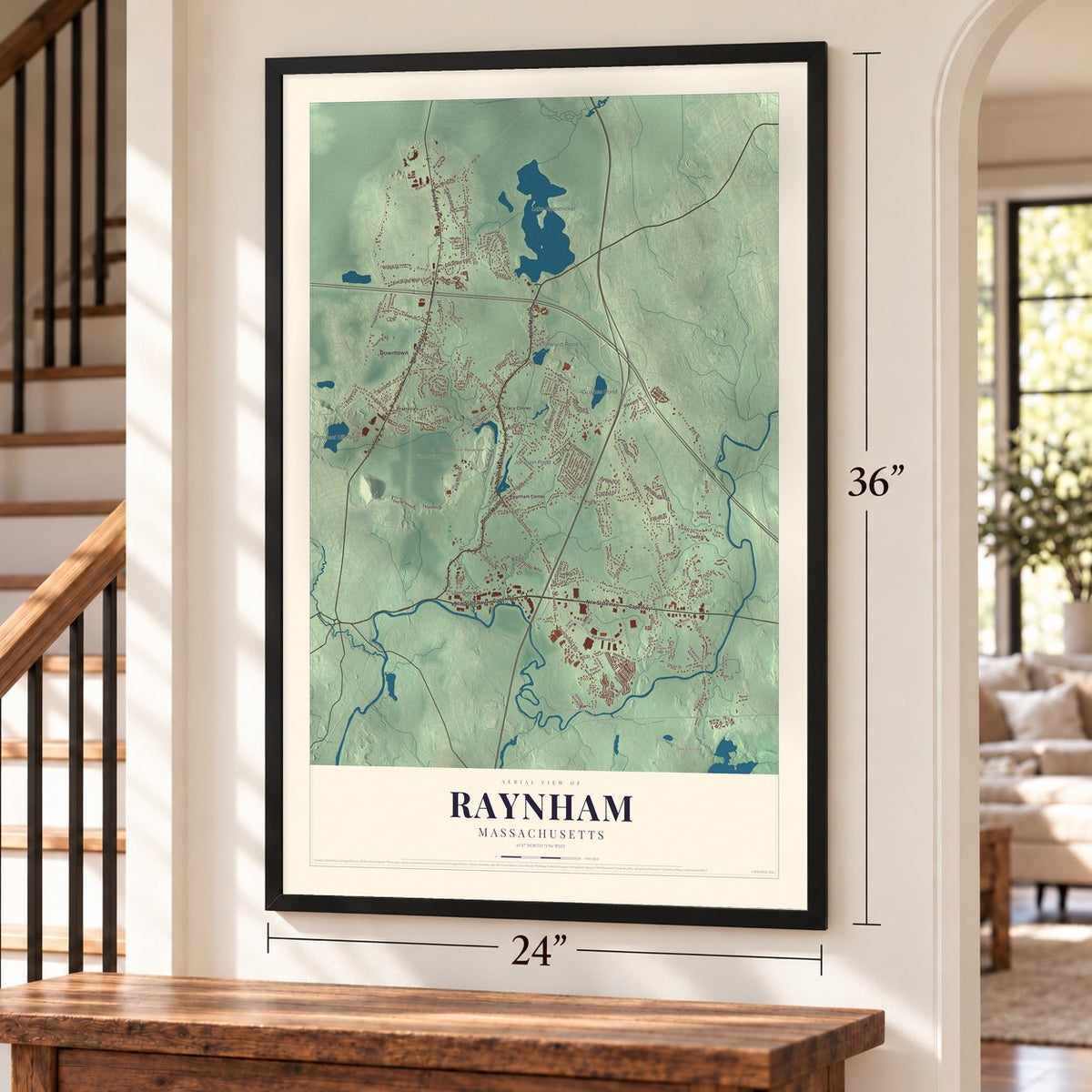 Raynham, Massachusetts map, 24 x 36 inch print in a black frame by a staircase