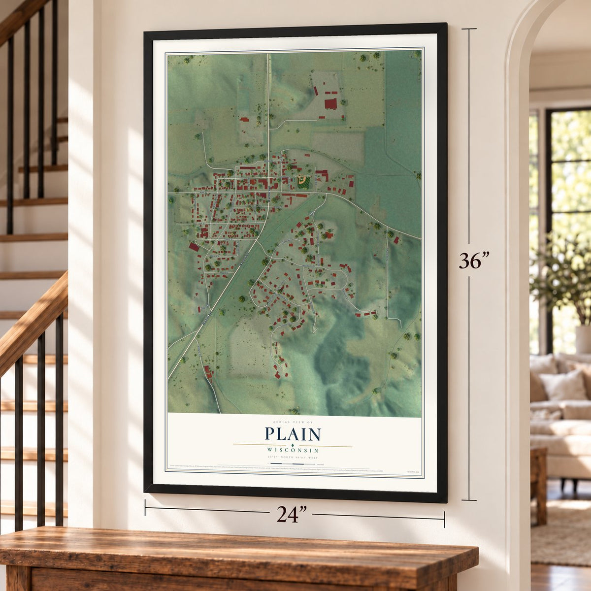 Plain, Wisconsin map, 24 x 36 inch print in a black frame by a staircase