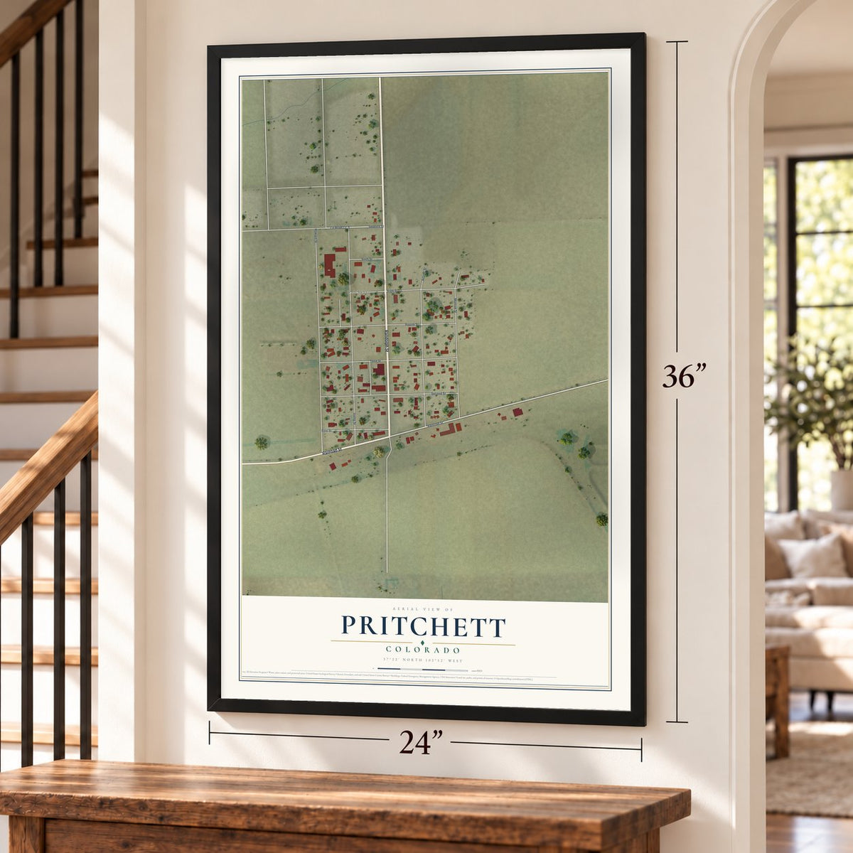 Pritchett, Colorado map, 24 x 36 inch print in a black frame by a staircase