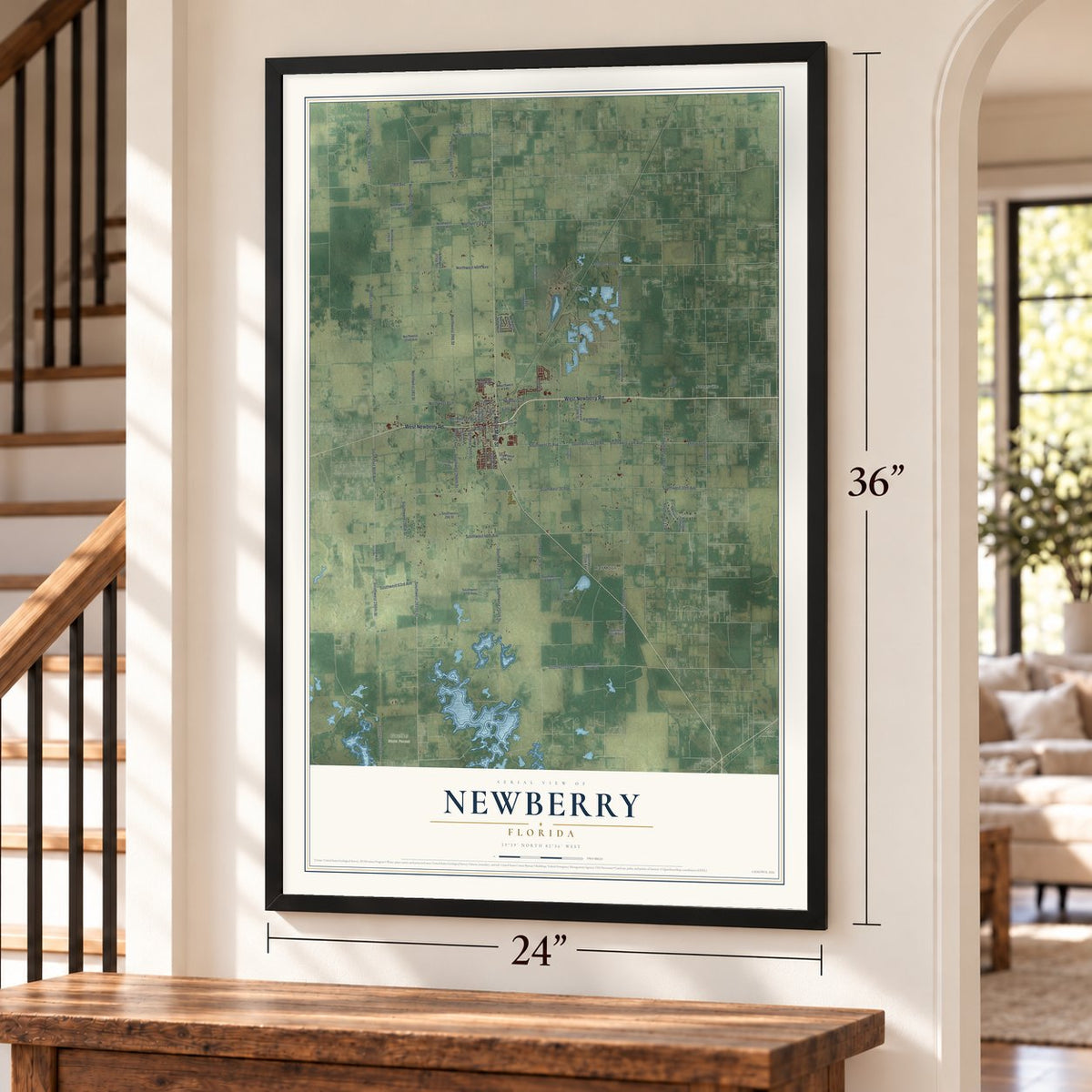 Newberry, Florida map, 24 x 36 inch print in a black frame by a staircase