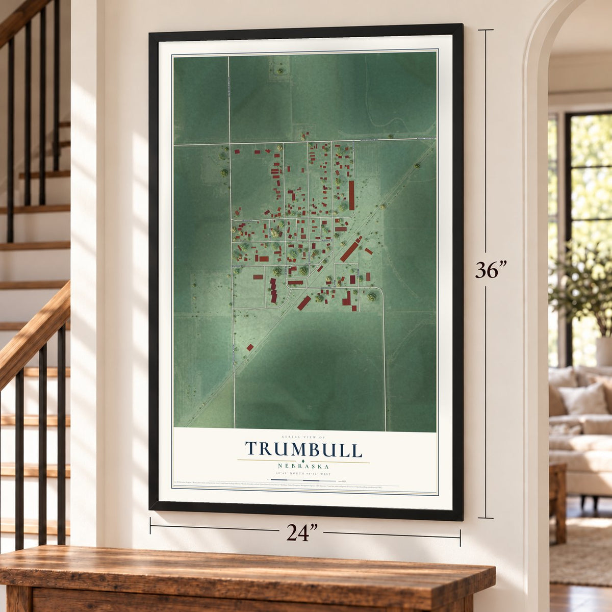Trumbull, Nebraska map, 24 x 36 inch print in a black frame by a staircase