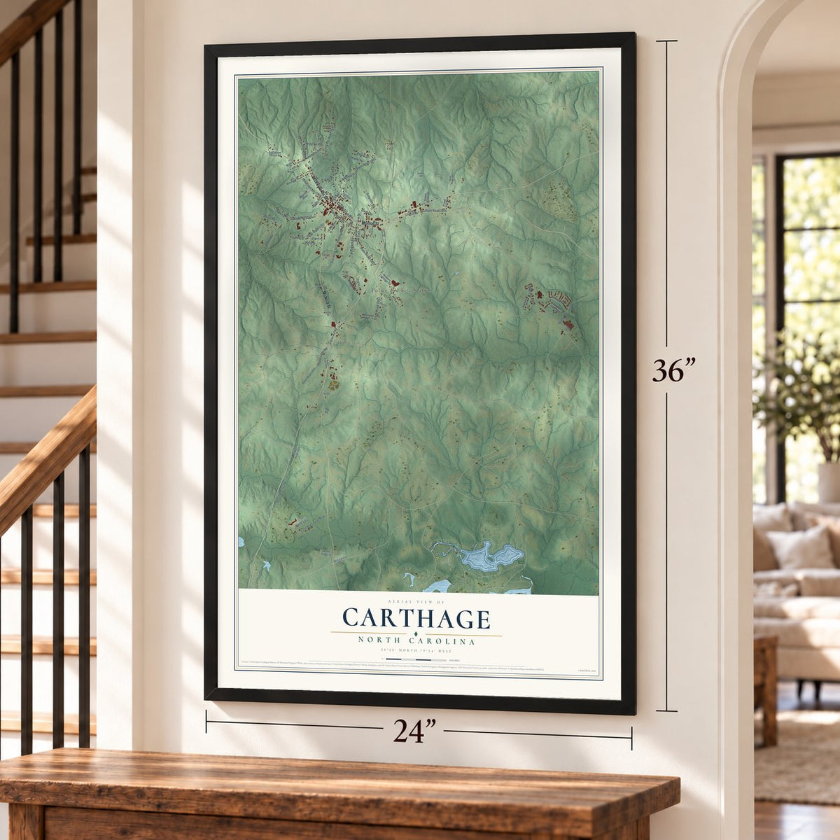 Carthage, North Carolina map, 24 x 36 inch print in a black frame by a staircase