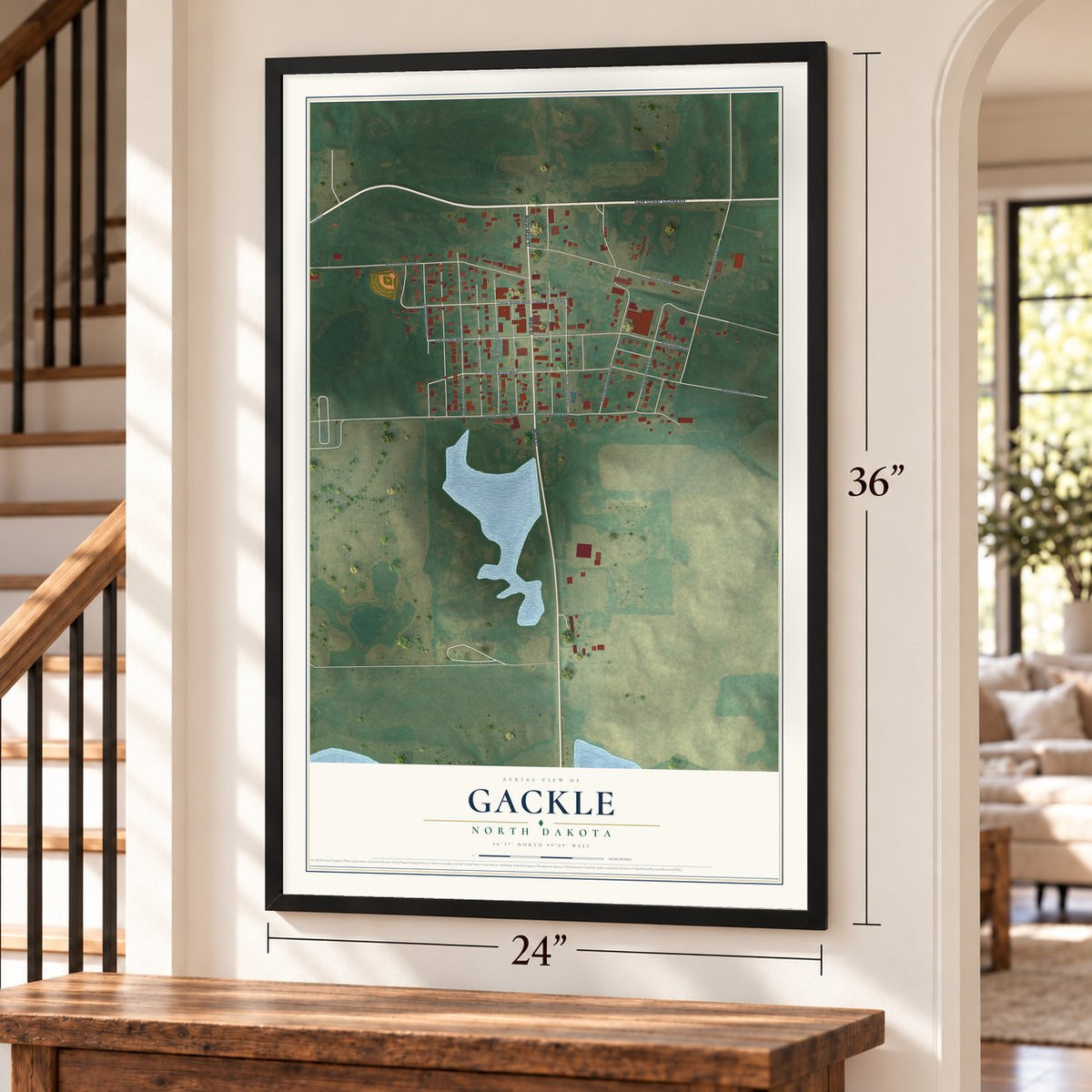 Gackle, North Dakota map, 24 x 36 inch print in a black frame by a staircase