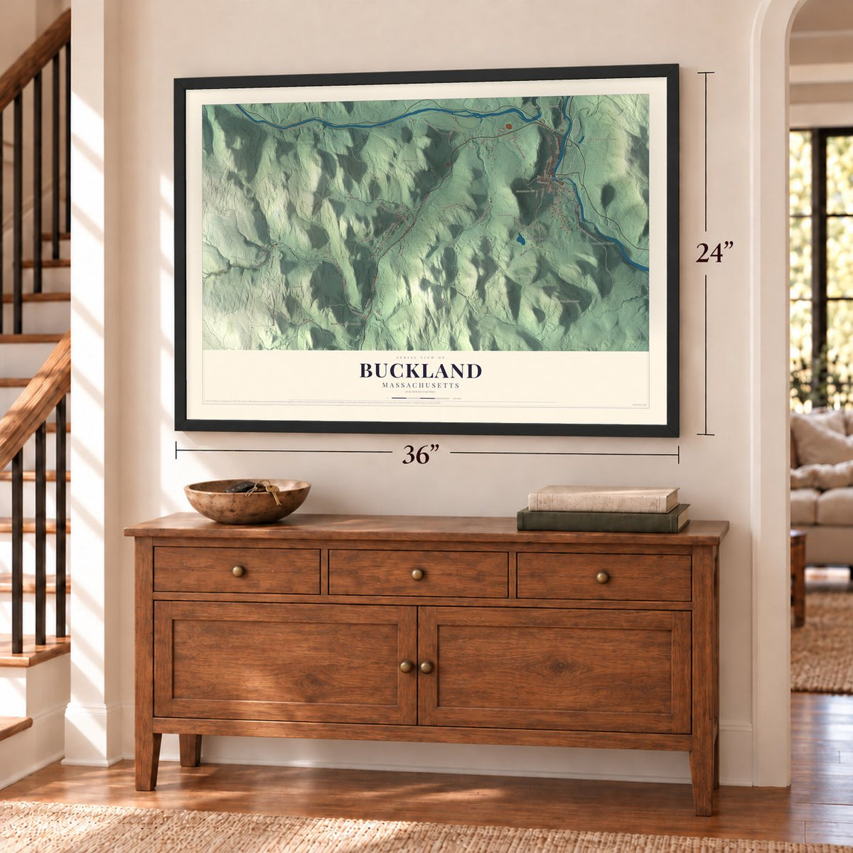 Buckland, Massachusetts map, 24 x 36 inch print in a black frame above a dresser by a staircase