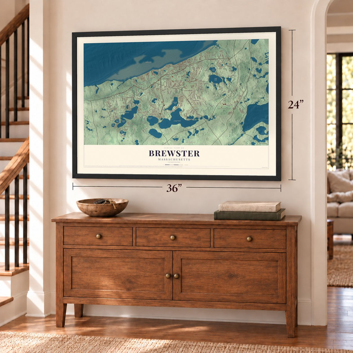 Brewster, Massachusetts map, 24 x 36 inch print in a black frame above a dresser by a staircase