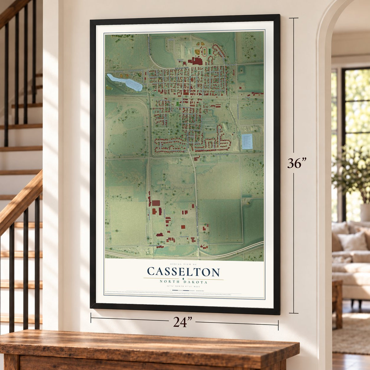 Casselton, North Dakota map, 24 x 36 inch print in a black frame by a staircase