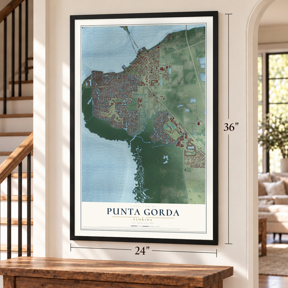 Punta Gorda, Florida map, 24 x 36 inch print in a black frame by a staircase