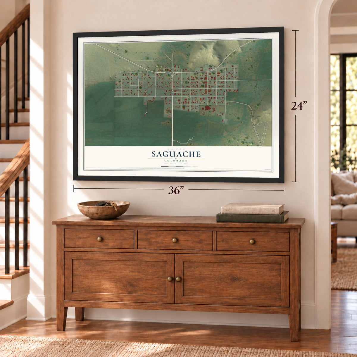 Saguache, Colorado map, 24 x 36 inch print in a black frame above a dresser by a staircase