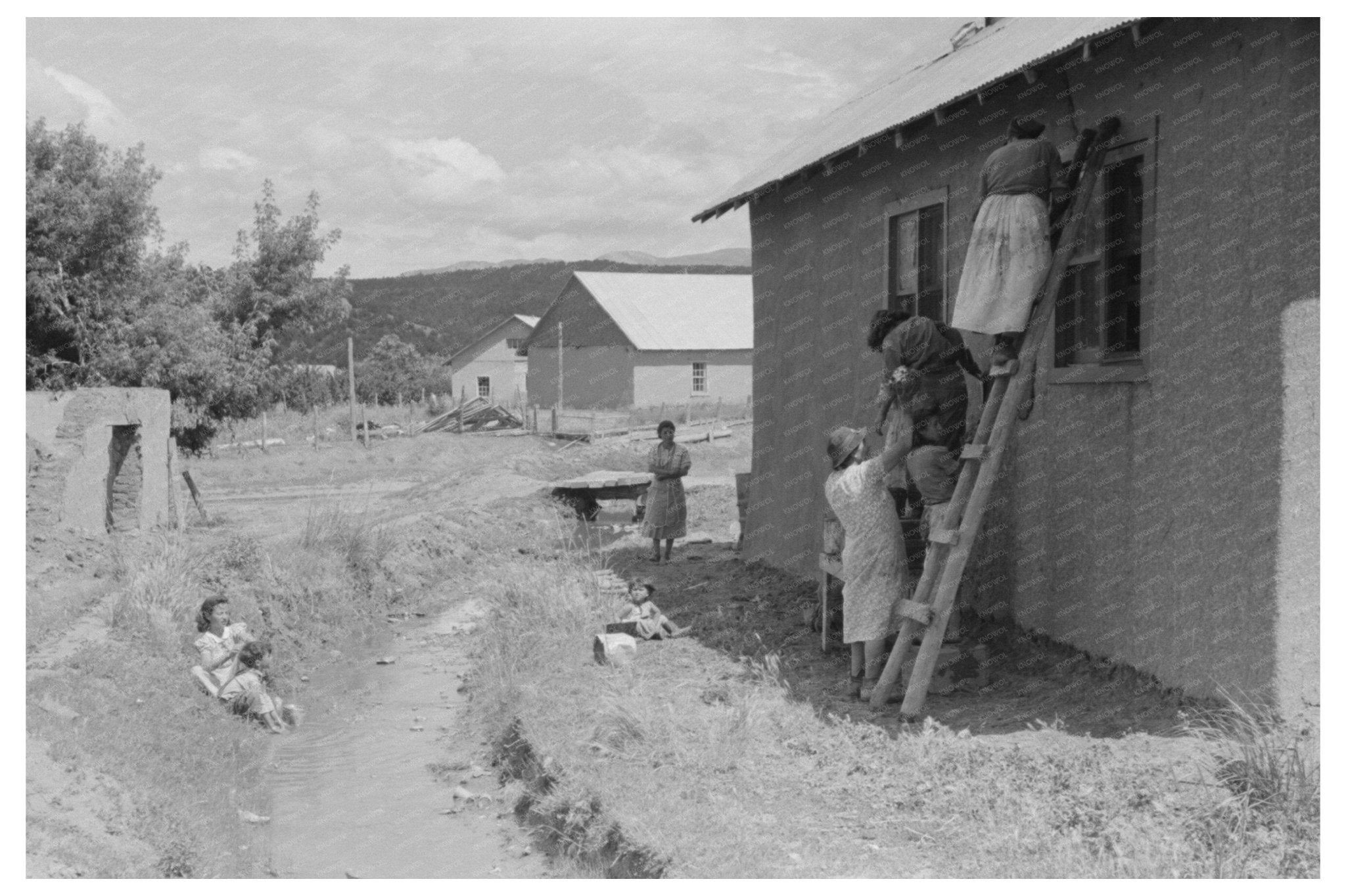 Adobe House Plastering and Washing in Chamisal 1940 - Available at KNOWOL