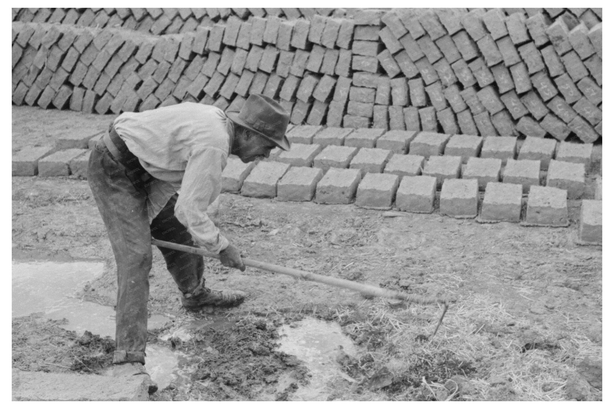 Adobe Mixing for Brick - Making Chamisal New Mexico 1940 - Available at KNOWOL