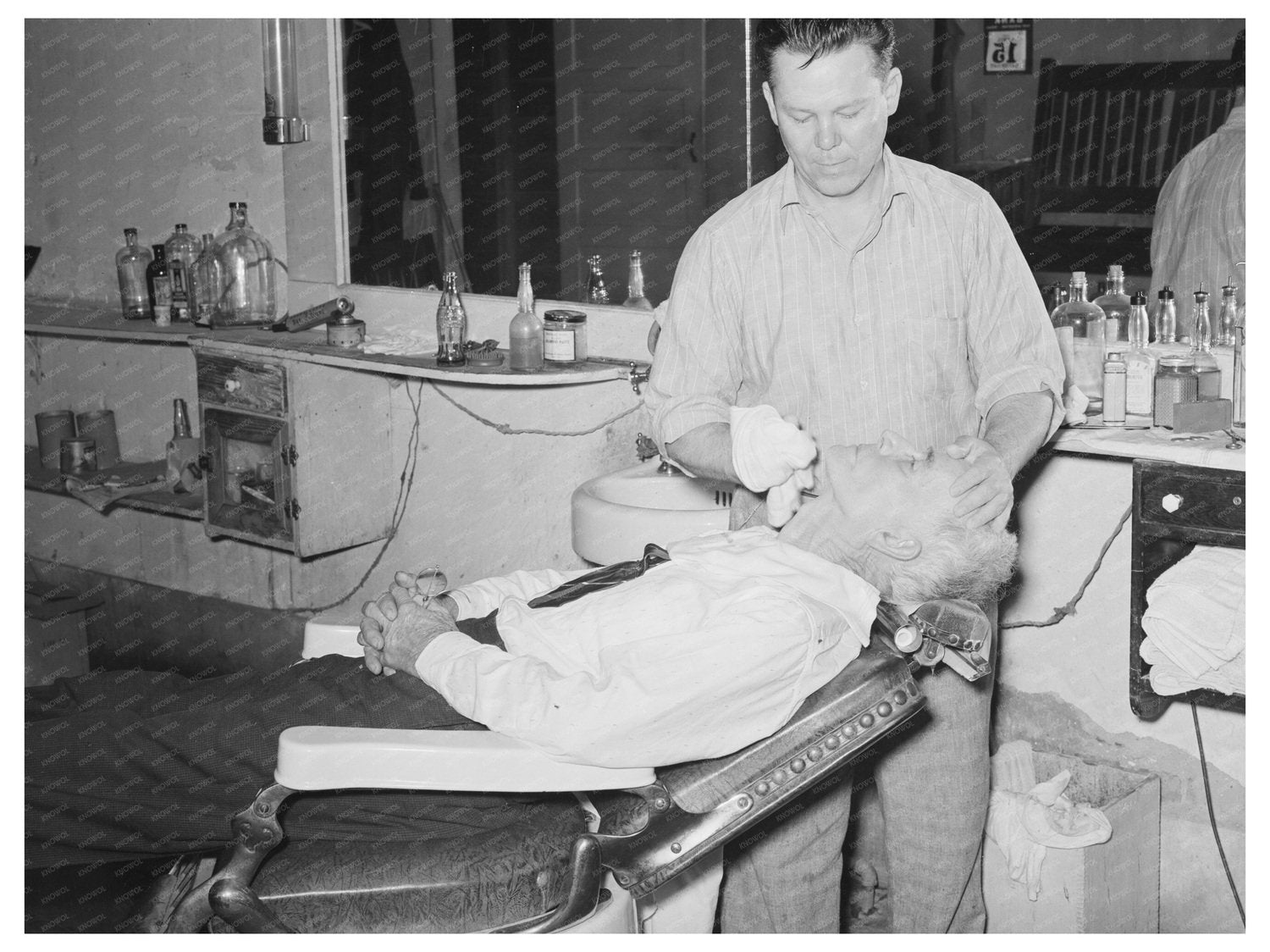 Barber Finishing Shave San Augustine Texas April 1939 - Available at KNOWOL