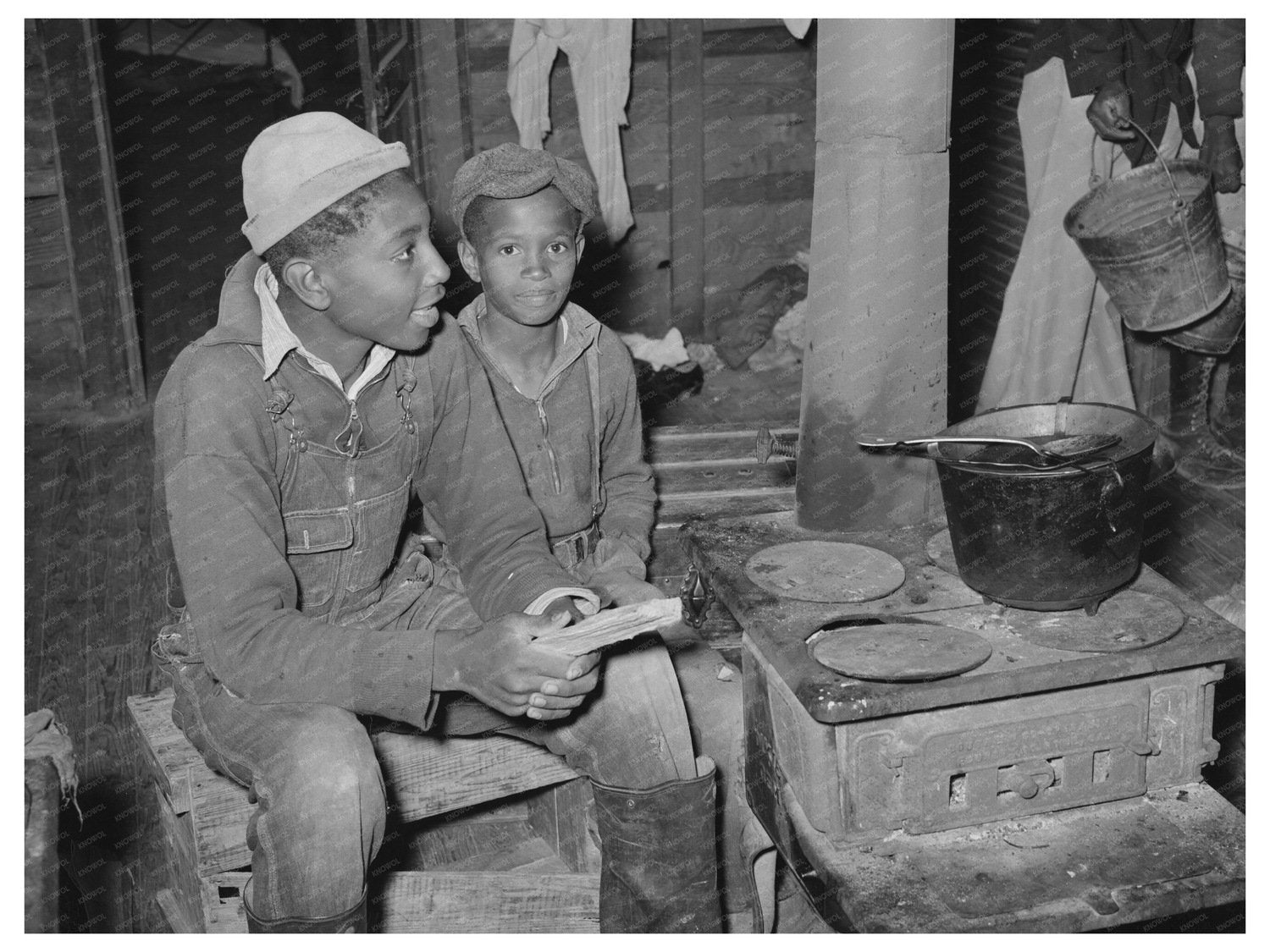 Berry Pickers Around Stove in Independence Louisiana 1939 - Available at KNOWOL