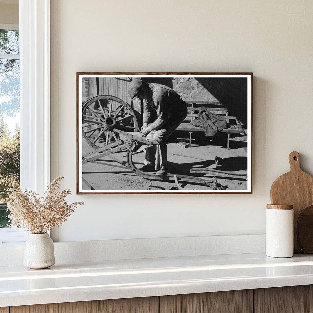 Blacksmith Helper Disassembling Plow February 1940 - Available at KNOWOL