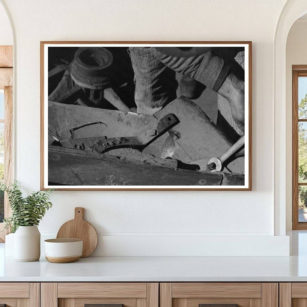 Blacksmiths Helper Disassembling Plow 1940 - Available at KNOWOL