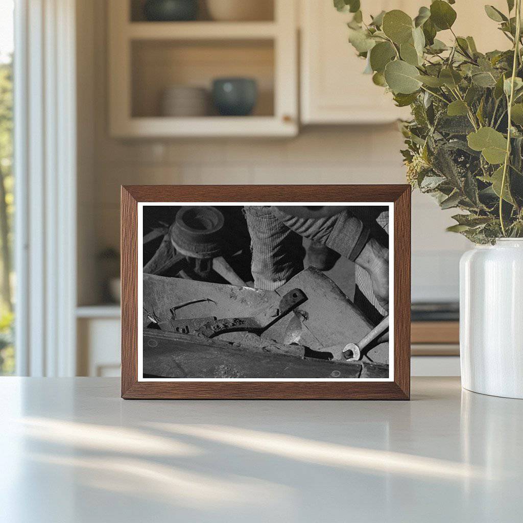 Blacksmiths Helper Disassembling Plow 1940 - Available at KNOWOL