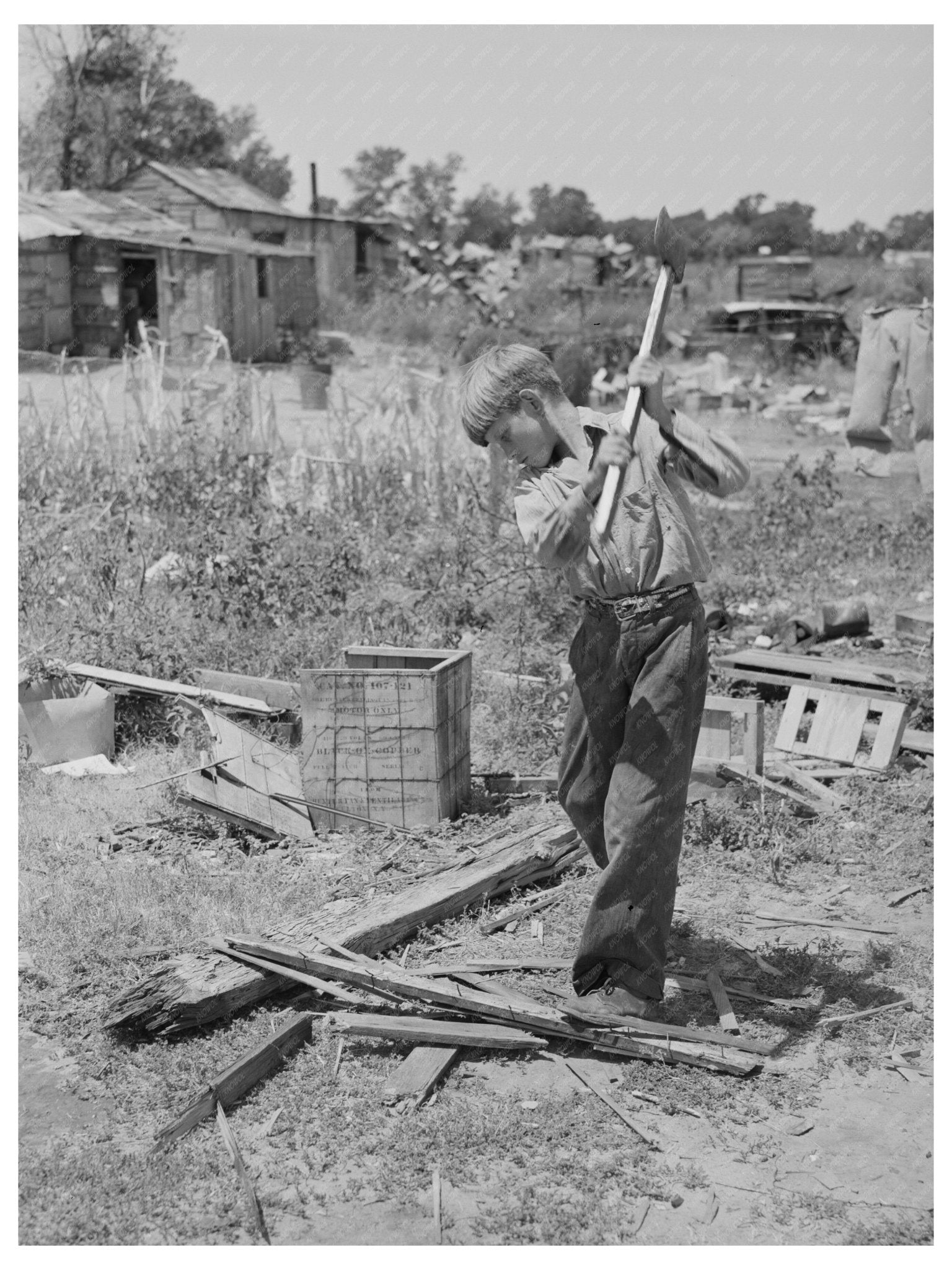 Boy Chopping Wood at Mays Avenue Camp Oklahoma City 1939 - Available at KNOWOL