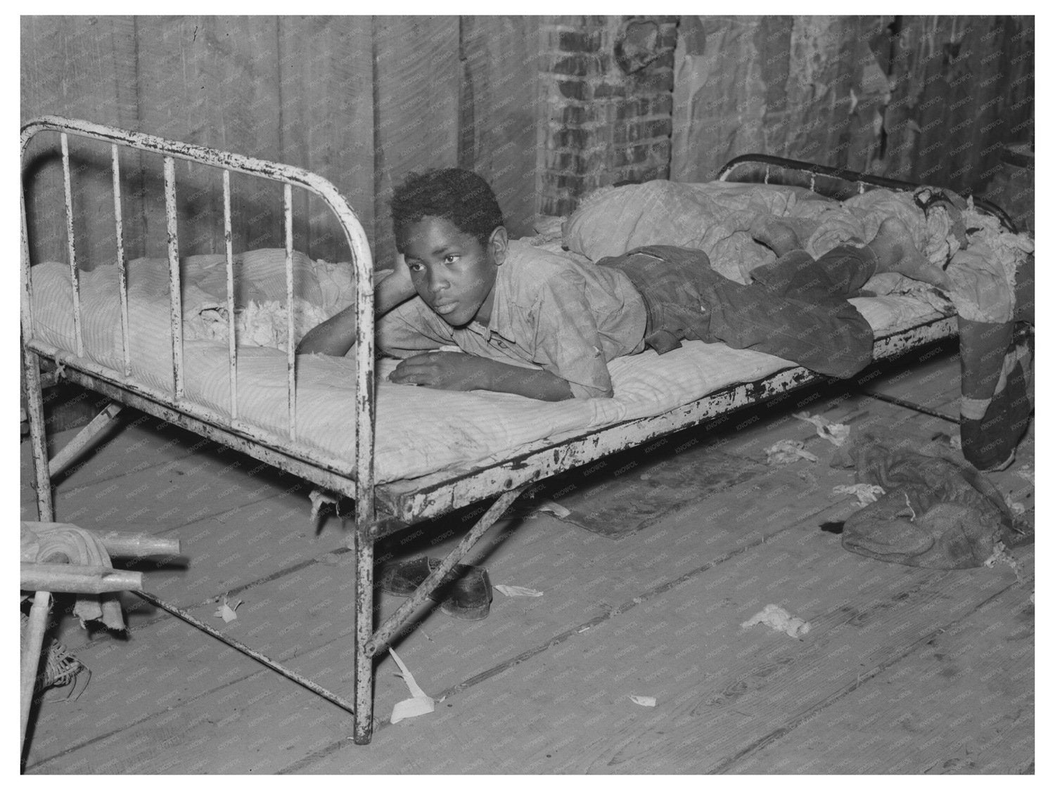 Boy Resting in Attic of Sharecropper Shack May 1938 - Available at KNOWOL