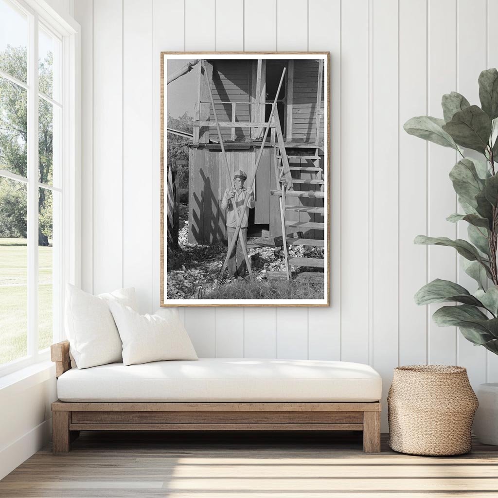 Boy Using Oyster Rake in Olga Louisiana 1938 - Available at KNOWOL