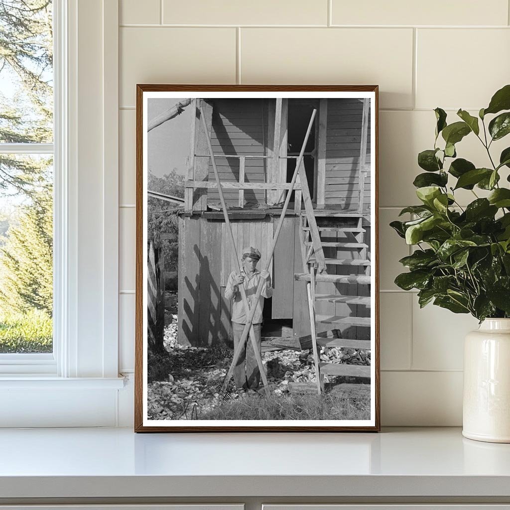 Boy Using Oyster Rake in Olga Louisiana 1938 - Available at KNOWOL