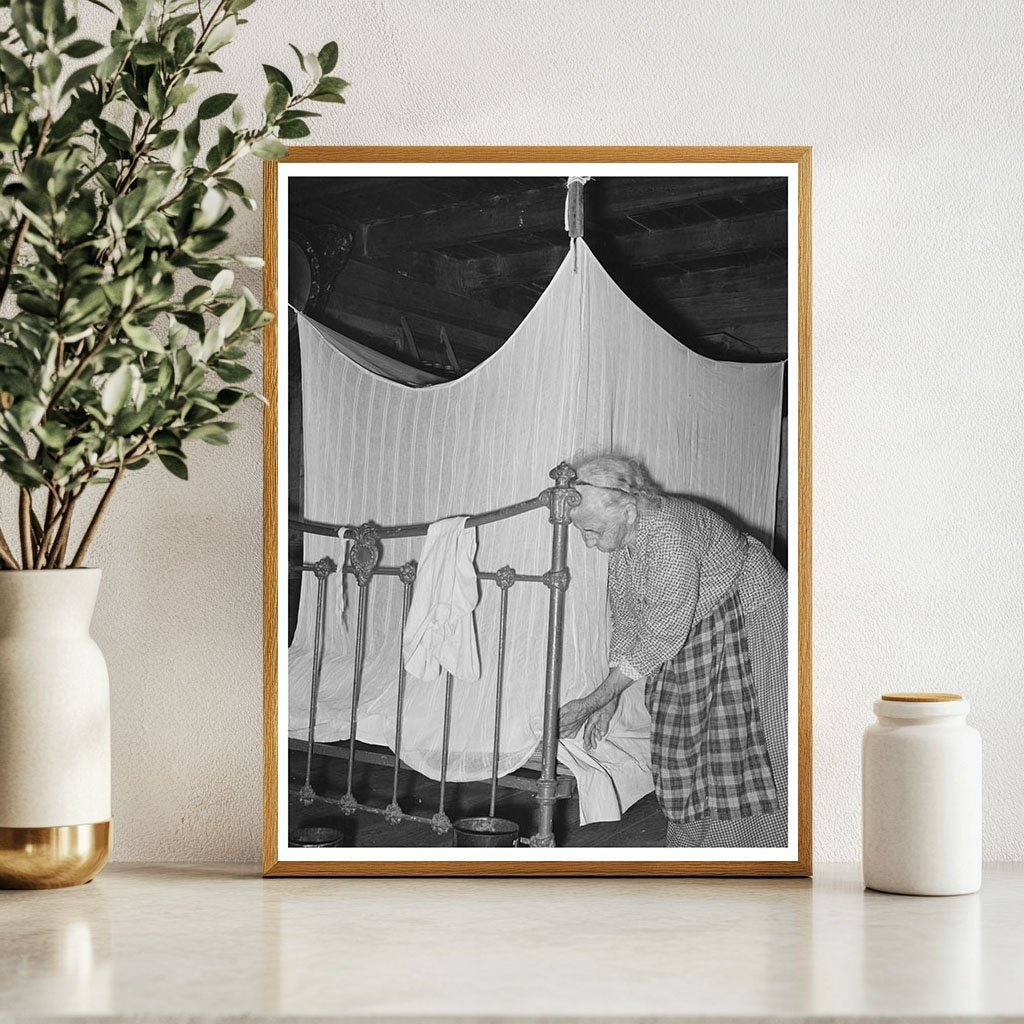 Cajun Woman Tucking Mosquito Bar Crowley Louisiana 1938 - Available at KNOWOL