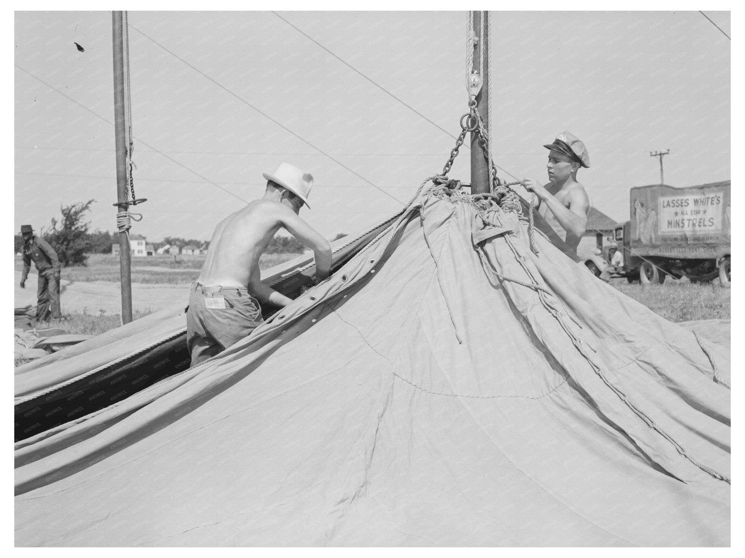 Carnival Crew Sets Up Tent for Lasses - White Show 1938 - Available at KNOWOL